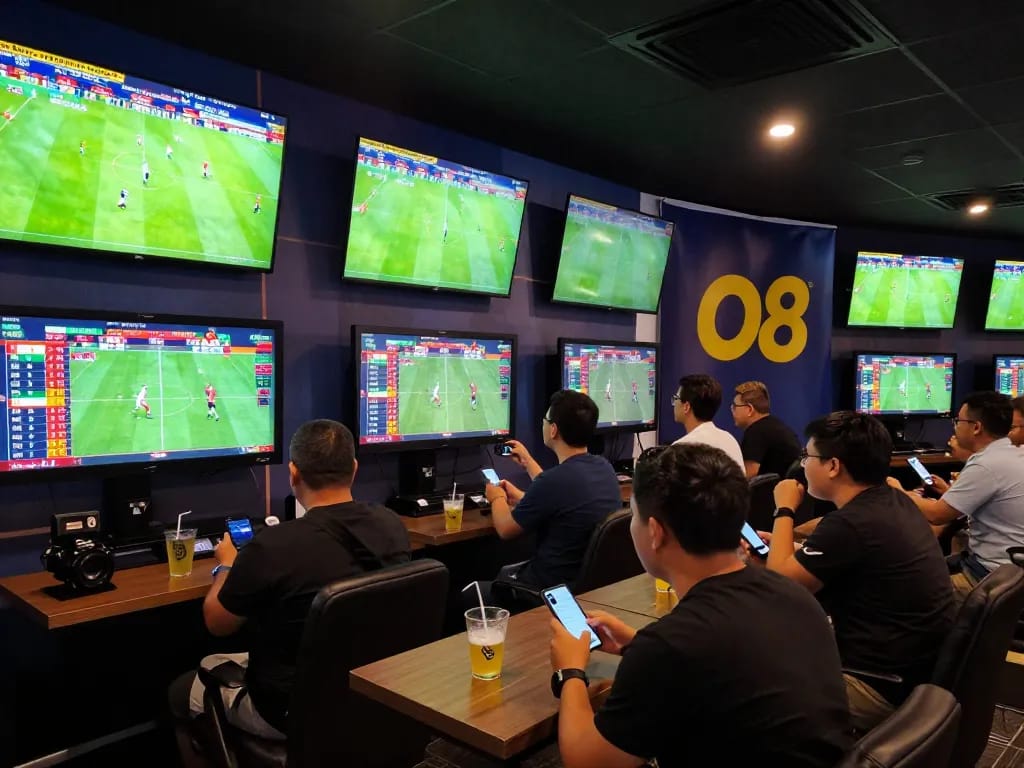 bóng đá o8 live betting action with enthusiastic fans in a dynamic sports lounge